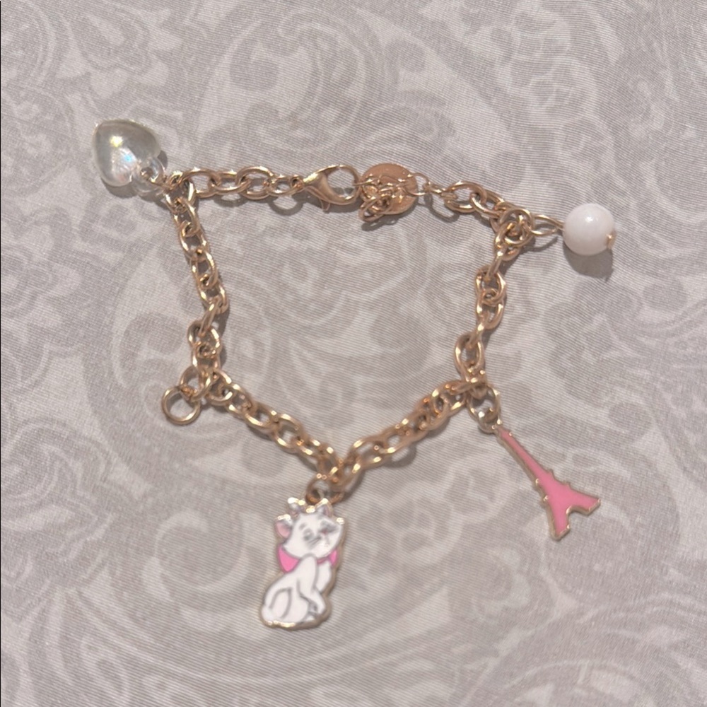 Gold Charm Bracelet with Pink and White Accents